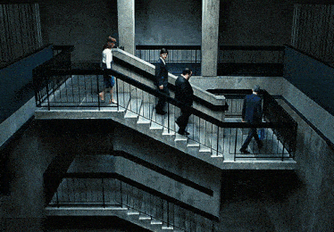 three people are walking down a set of stairs
