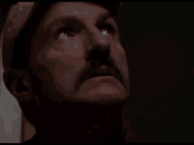 a man with a mustache and a hat says we need more time