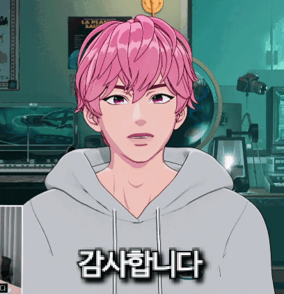 a man with pink hair is wearing a gray hoodie with korean writing on it