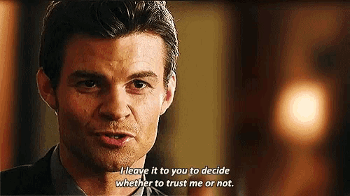 a man in a suit and tie is saying " i leave it to you to decide whether to trust me or not "