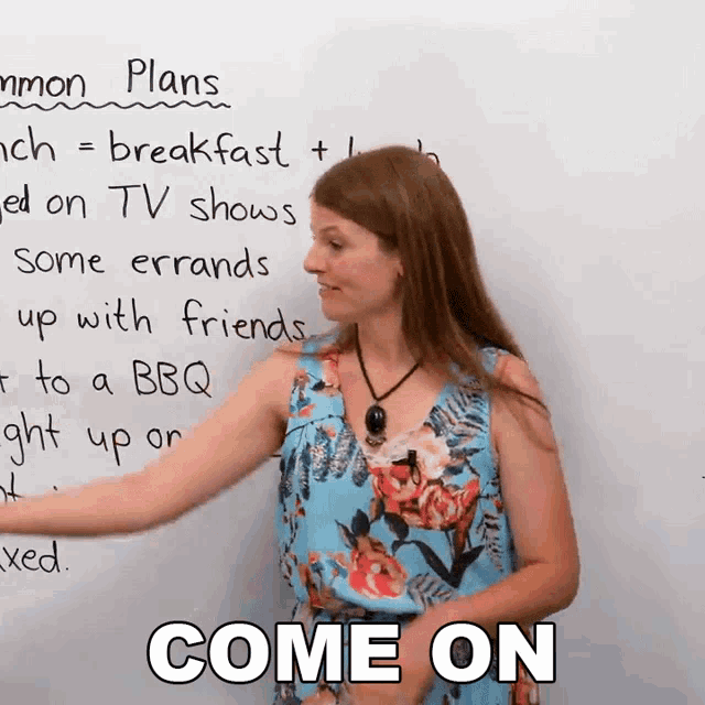 a woman stands in front of a white board with the words come on on it