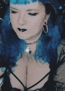 a woman with blue hair and black lipstick is wearing a black top