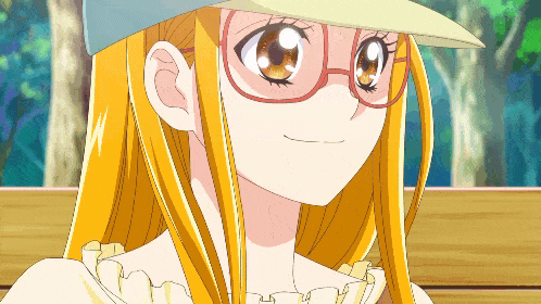 a girl with glasses and a hat is smiling