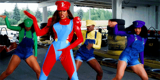 a woman in a mario costume is surrounded by other people in overalls