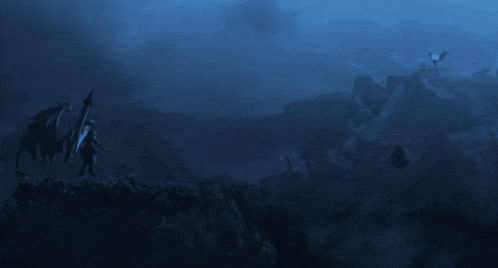 a person standing on a cliff with a dragon flying in the sky
