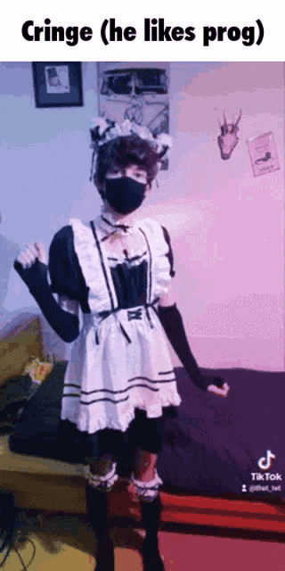 a person in a maid costume is standing in front of a bed