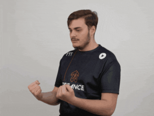 a man wearing a shirt that says ftt on it