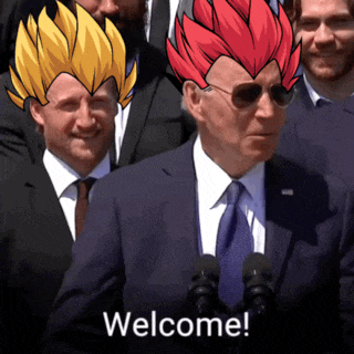a man in a suit and tie is standing in front of a microphone with the words welcome on the bottom