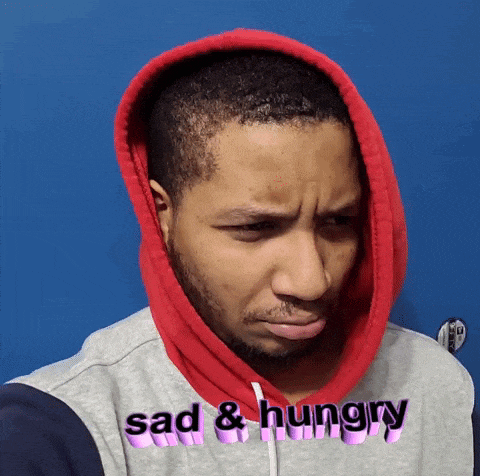 a man is wearing a hoodie that says sad & hungry