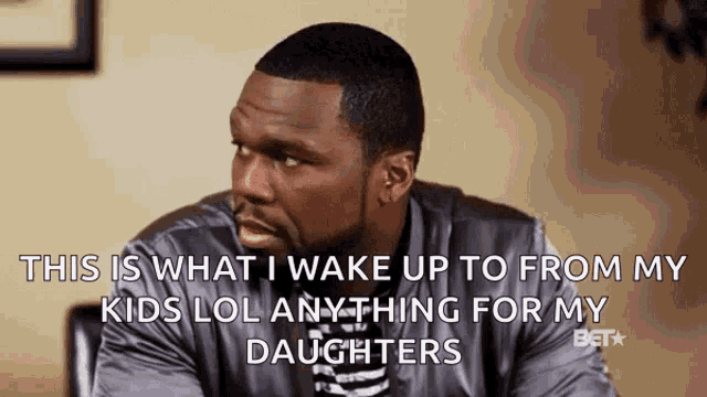 a man is sitting at a table and says this is what i wake up to from my kids lol anything for my daughters ..