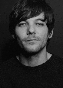 a black and white photo of a man with a beard and long hair .