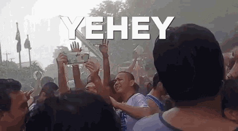 a crowd of people with the word yehey in white