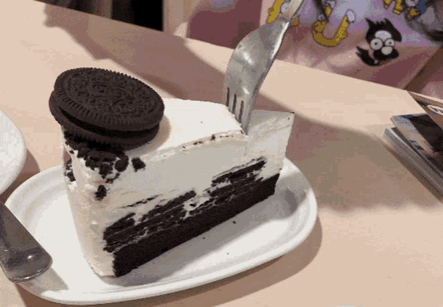 a slice of cake with an oreo cookie on it