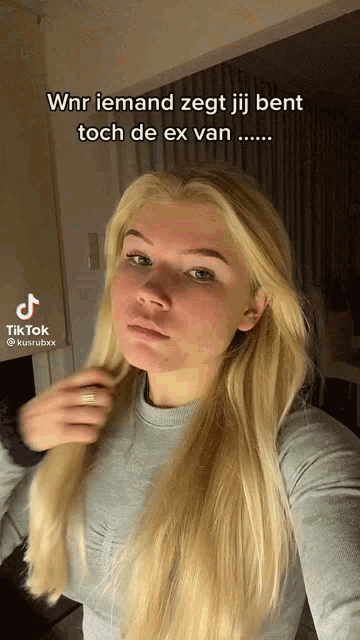 a woman taking a selfie with a caption that says wnr iemand zegt jij bent toch de ex van