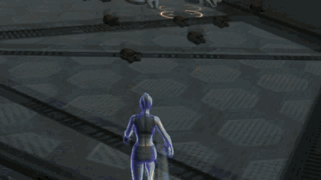 a woman is standing next to a robot in a dark room
