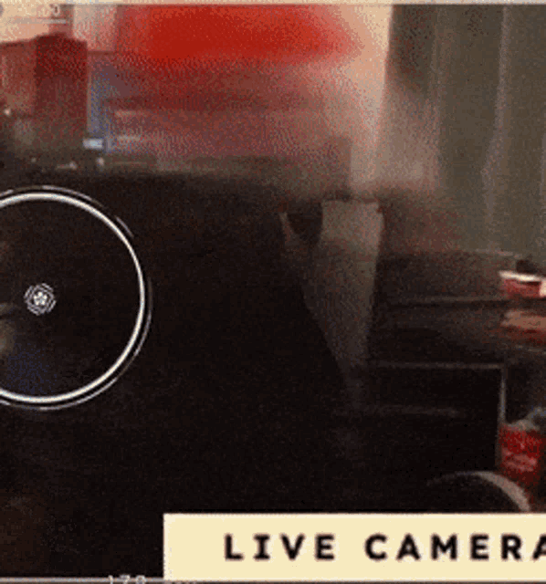 a blurred image of a camera with the words live camera on the bottom