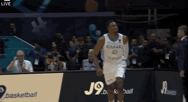 a basketball player wearing a jersey that says eaas on it