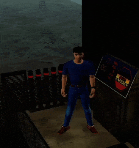 a man in a blue shirt is standing in front of a sign that says " flammable "