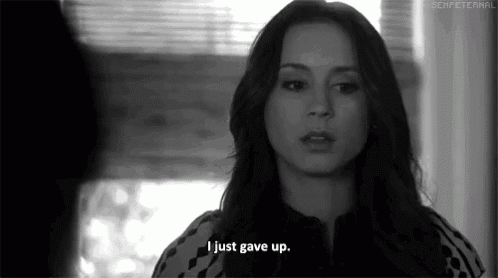 a woman says i just gave up in a black and white photo .