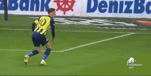 a soccer player is running on a soccer field .