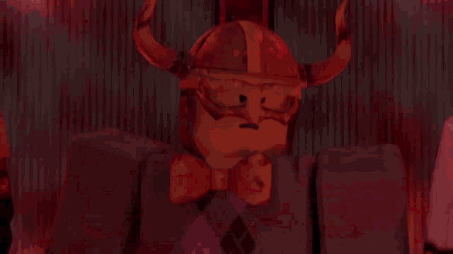 a man in a suit and a chef 's hat are standing next to each other in a dark room .