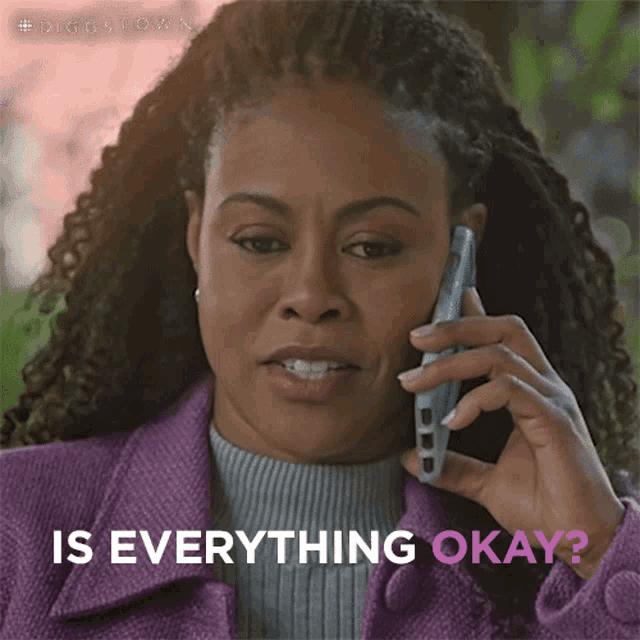 a woman in a purple coat is talking on a cell phone and the caption says " is everything okay "