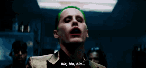 a close up of a man with green hair and red lips saying bla bla bla