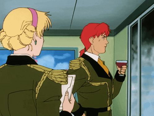 a man with red hair is holding a glass of wine next to a woman