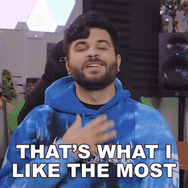 a man with a beard wearing a blue tie dye hoodie says that 's what i like the most