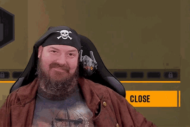 a man with a beard wears a pirate hat and holds a bottle of beer