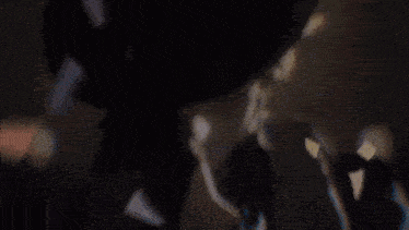a blurry picture of a person 's face with a hat on