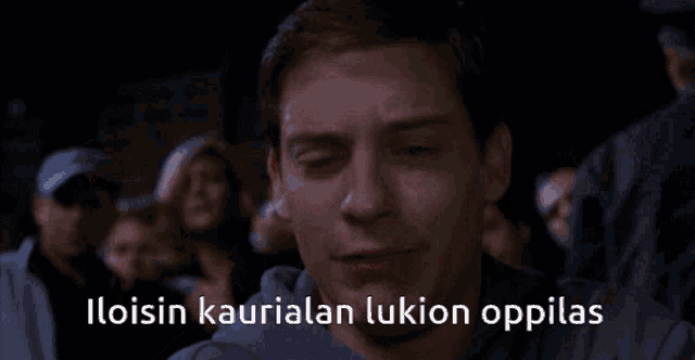 a man is crying with the words iloisin kaurialan lukion oppilas written below him