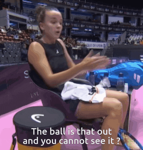 a woman sitting in a chair with the words " the ball is that out and you cannot see it " written below her