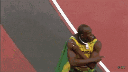 a man in a yellow and green jersey with bolt on it
