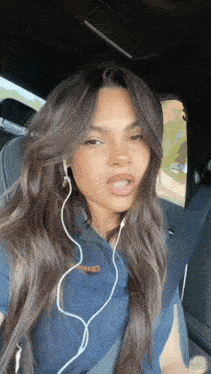 a woman wearing headphones and a shirt that says ' o'maro ' on it