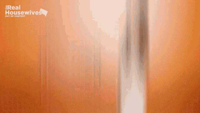 a blurred image of a woman with the words real housewives out of context behind her