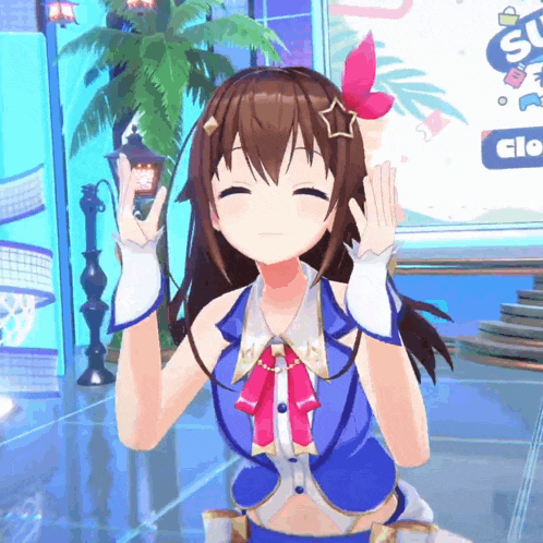 a girl in a blue outfit with a star on her head is smiling