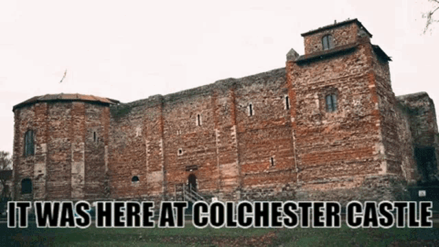 a large brick building with the words it was here at colchester castle