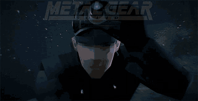 a man in a hat is looking through a microscope in the dark