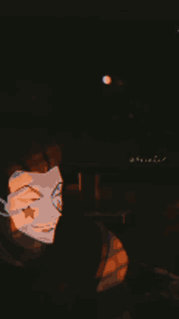 a person wearing a mask with a star on it