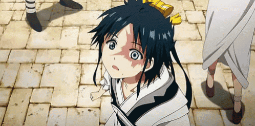 a boy with blue hair is looking up at something in the sky
