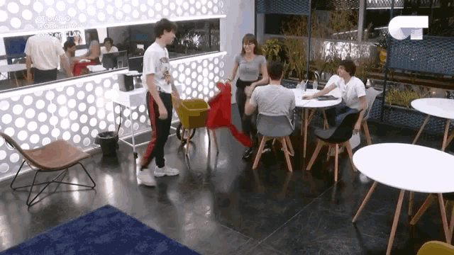 a group of people sitting at tables in a room