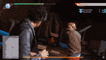 a man in a leopard print shirt is fighting another man in a leather jacket in a video game