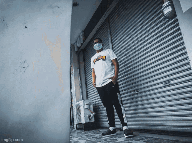 a man wearing a thrasher shirt stands in front of a store