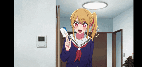 a girl in a school uniform is holding a card