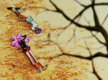two anime girls laying on the ground with leaves