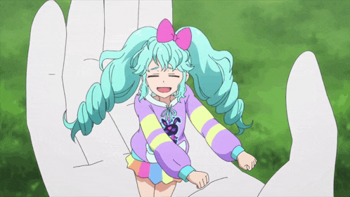 a little girl with blue hair and a pink bow is being held by a white hand