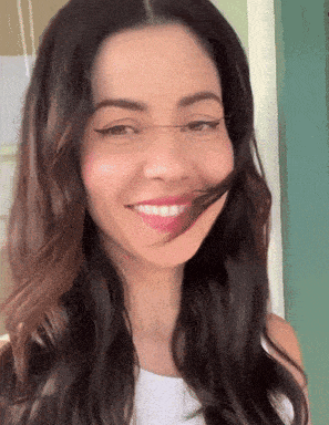 a close up of a woman 's face with a smile on her face