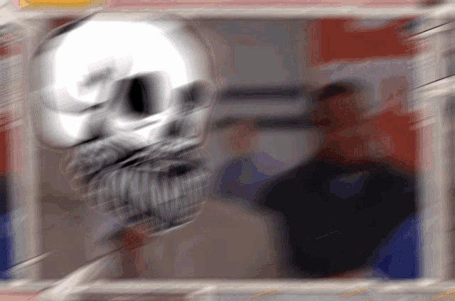 a blurry picture of a skull and a man
