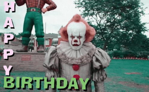a clown is standing in front of a statue with the words happy birthday written below him